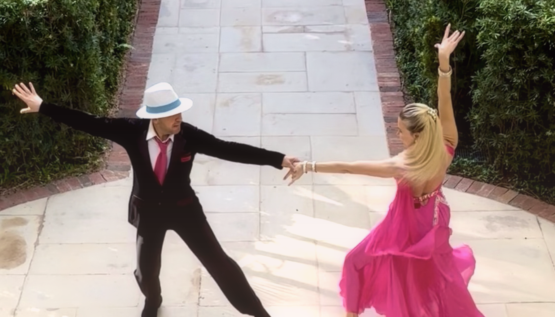 Bright glamorous Palm Beach couple in an elegant South Florida home beginning a private dance lesson with warm encouragement and growing confidence